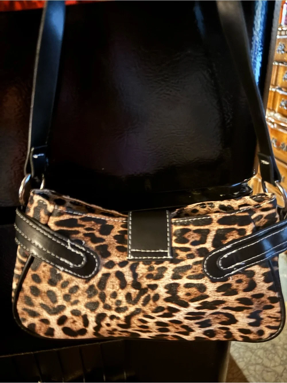 Leopard Print Shoulder Bag with Black Trim and Buckle Accent